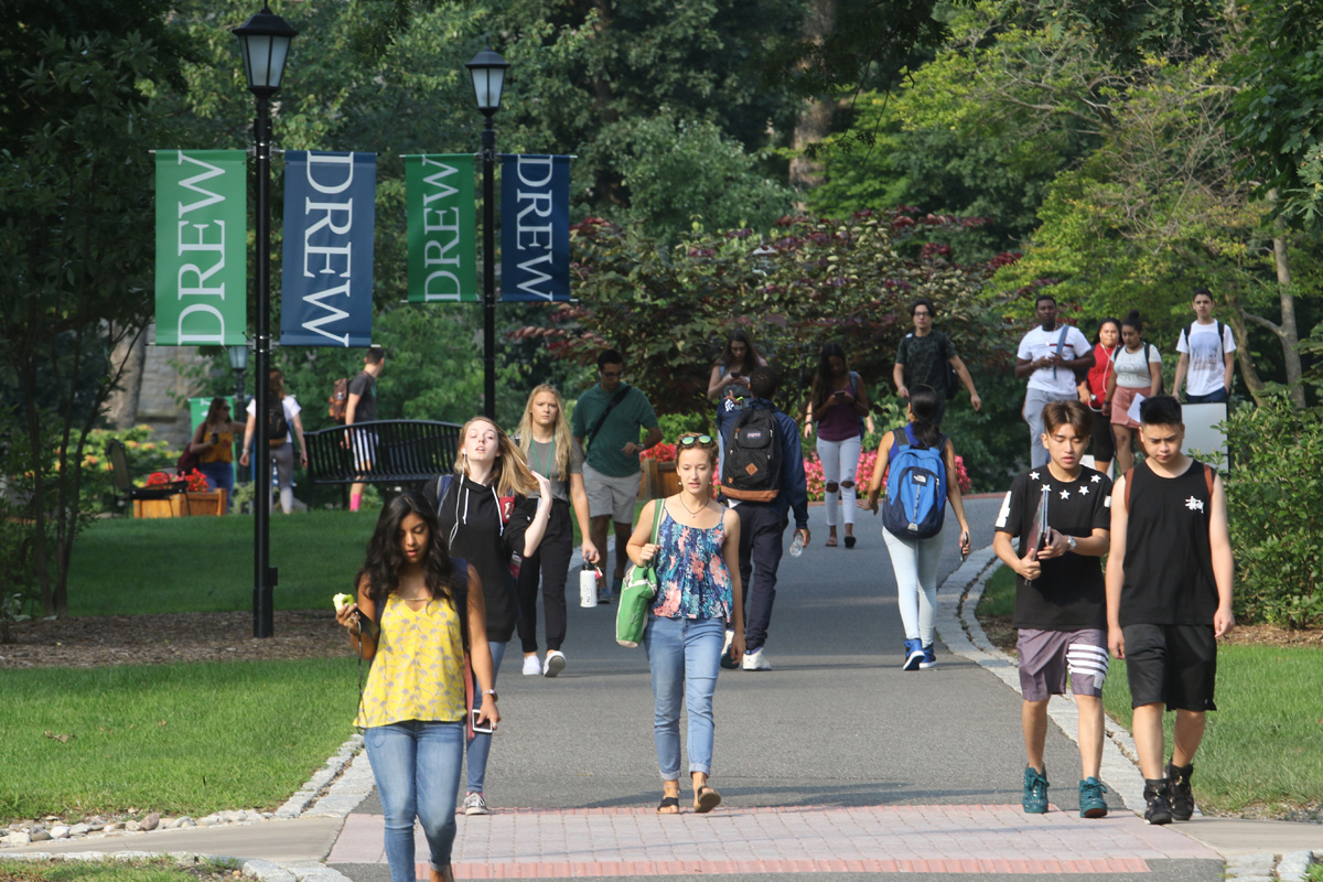 Drew students walking on a campus path