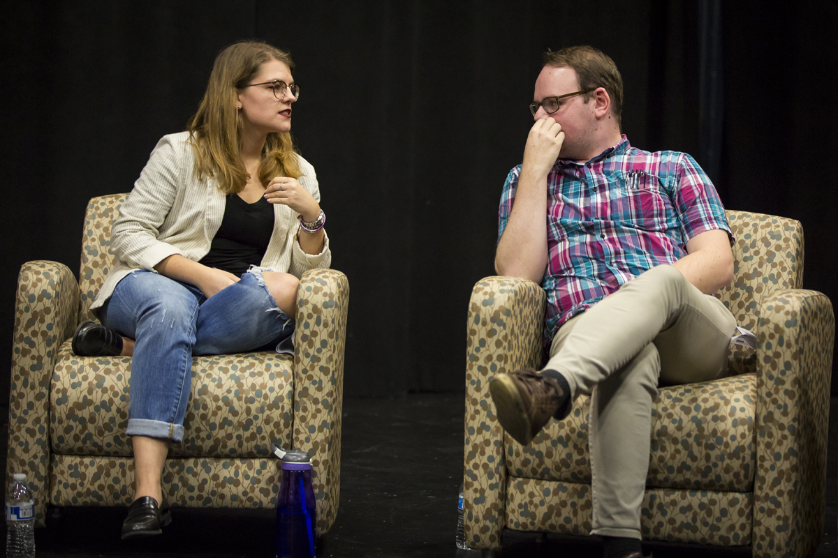 Emily Dzioba and Andrew Barnes seated next to each other in separate chairs