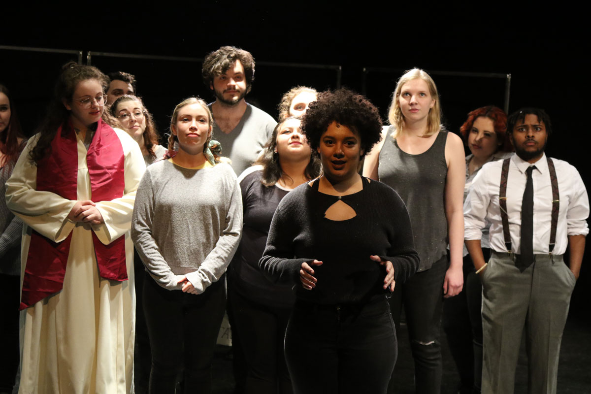 A cast of students on stage
