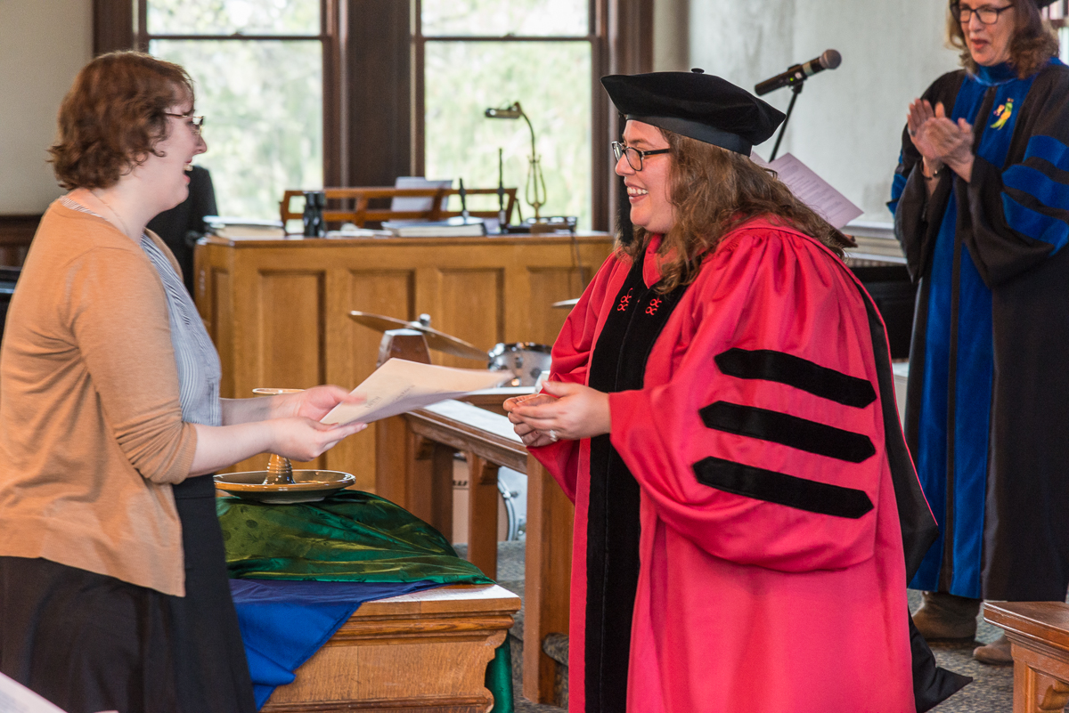 Olivia Cunningham DiAgostino receives an award.