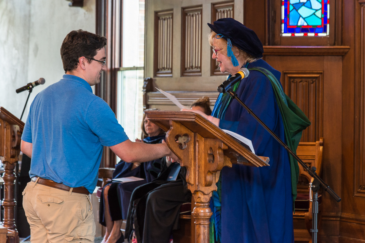 Leif McLellan receiving an award.