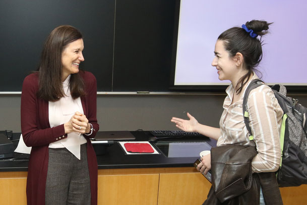 Scientist talking to female student