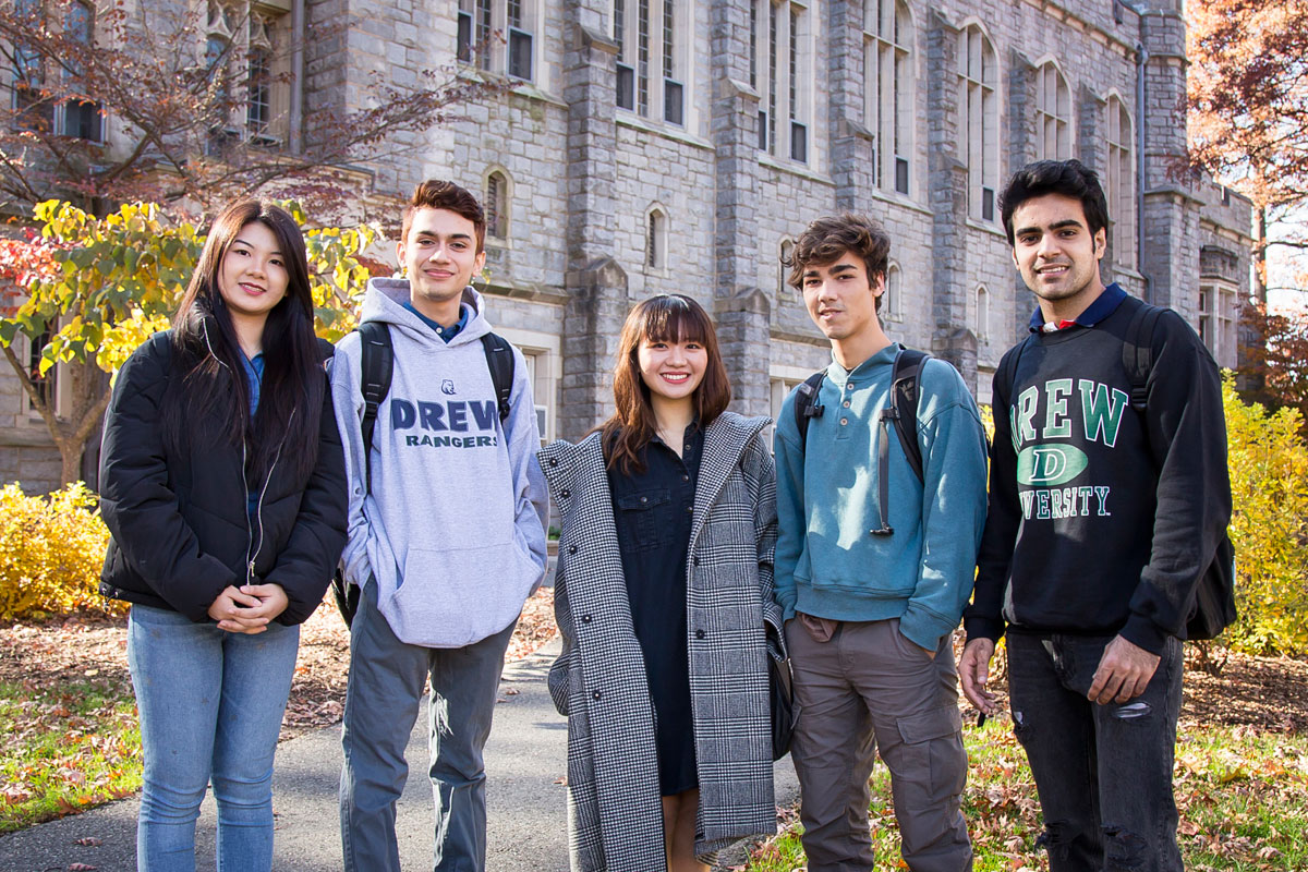 Group of international students standing in front of S.W. Bowne Hall