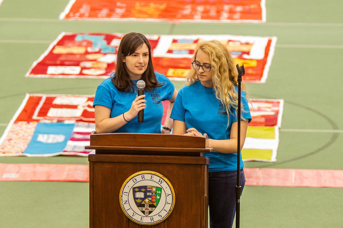 Cassie Allen and Katie Sparks behind a lectern