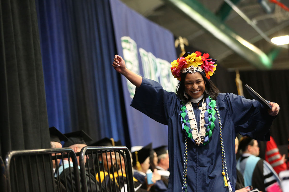 Woman celebrating after receiving a diploma