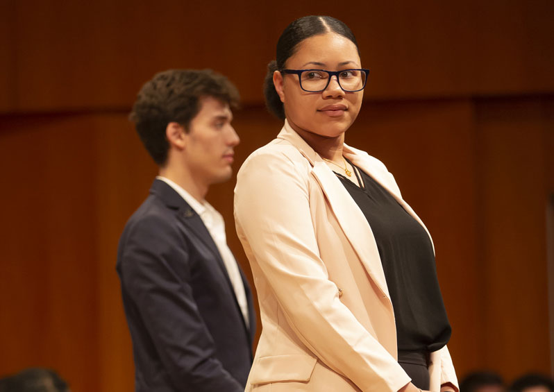 Emilio Peñate and Janaya Reeves standing on stage