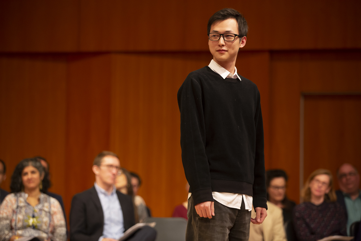 Peiyu Guo standing on stage