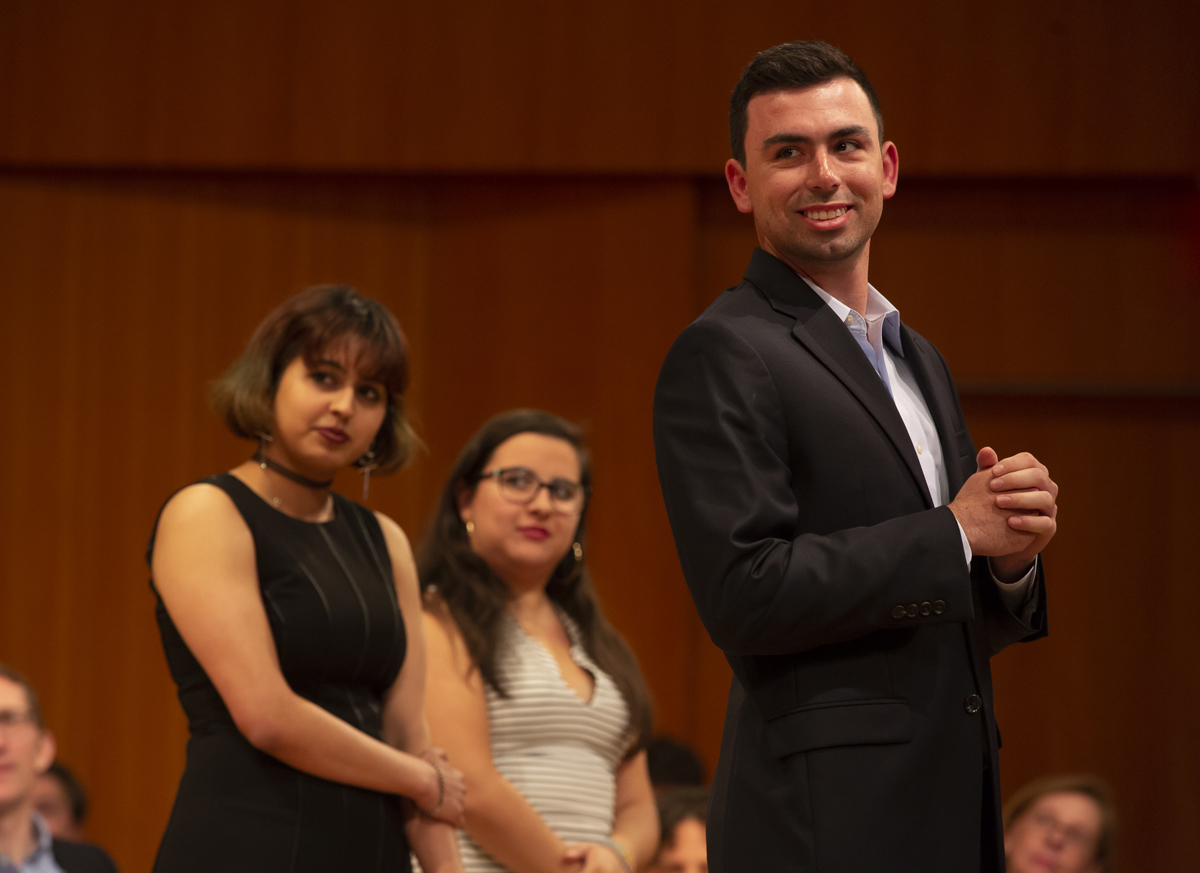 Priya Dutt, Kassel Franco Garibay and Harold Cohen standing on stage