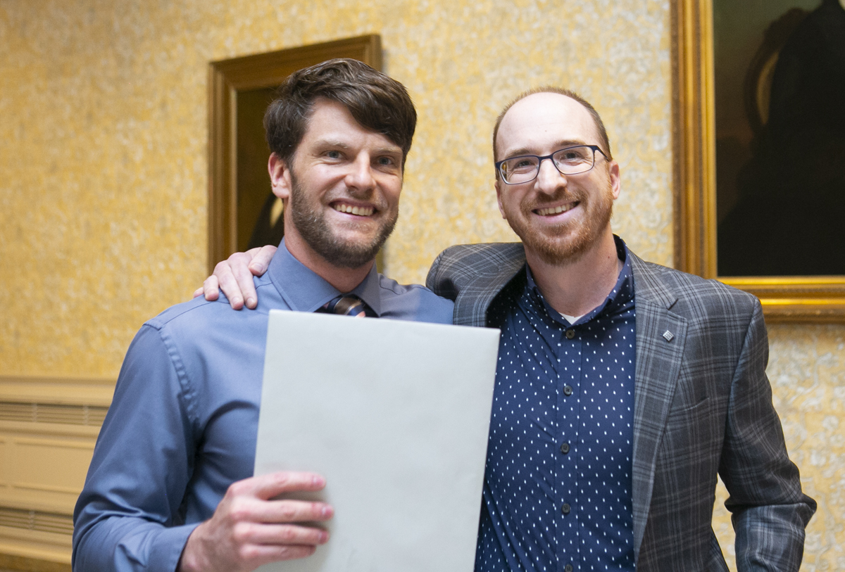 Award winner Daniel Michalak standing next to fellow graduate student Brian Shetler