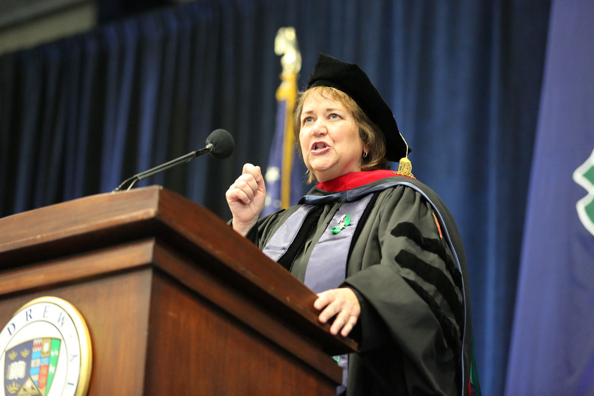 Karen Oliveto speaking behind a lectern