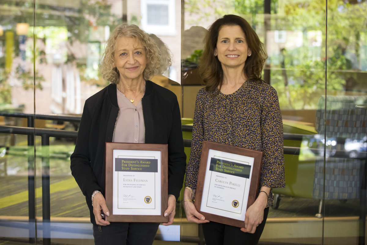 Lydia Feldman and Carolyn Parelli standing side by side while holding their awards