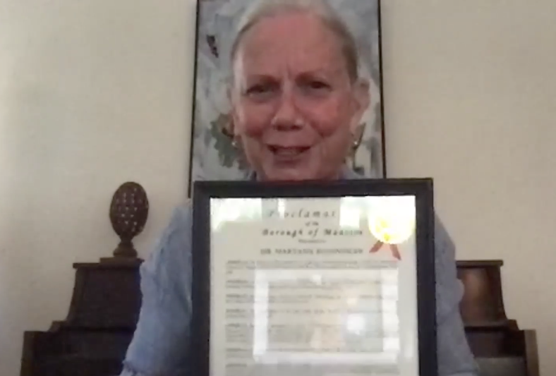 Baenninger Holds Up Her Proclamation